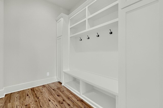 mudroom with light hardwood / wood-style floors