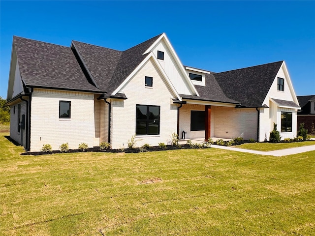 modern inspired farmhouse with a front yard