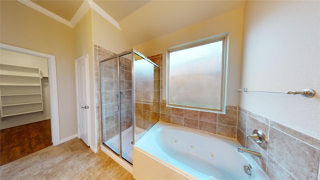 bathroom with wood-type flooring, vaulted ceiling, plus walk in shower, and ornamental molding