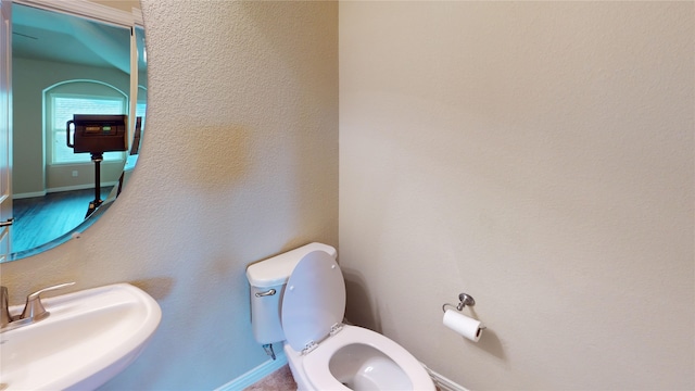 bathroom featuring sink and toilet