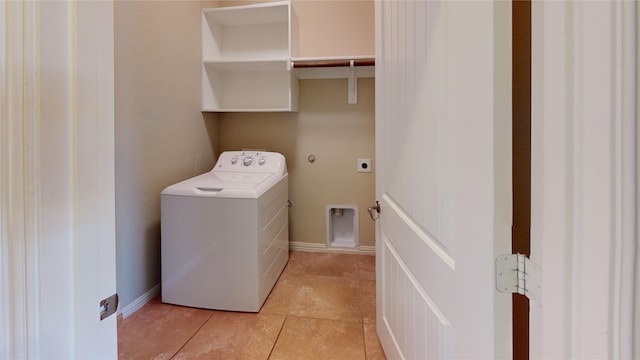 washroom with light tile patterned floors and washer / dryer