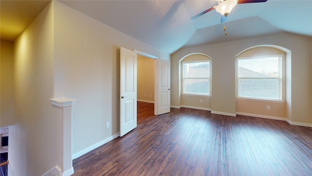 unfurnished room featuring ceiling fan, vaulted ceiling, and dark hardwood / wood-style flooring