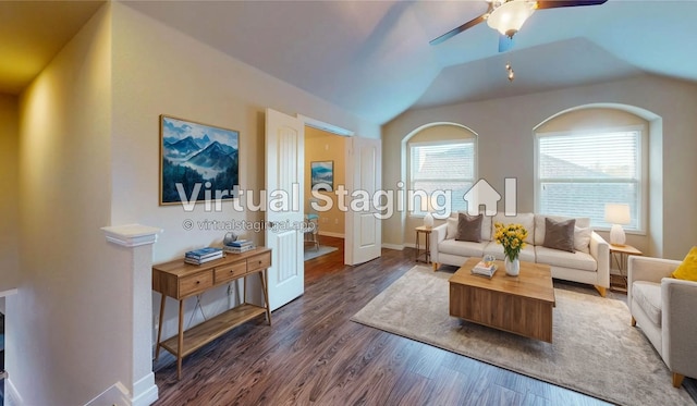 living room with ceiling fan, lofted ceiling, plenty of natural light, and dark hardwood / wood-style flooring