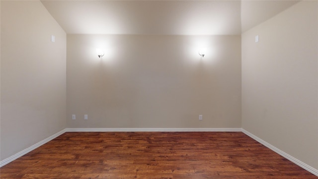 empty room featuring dark hardwood / wood-style flooring