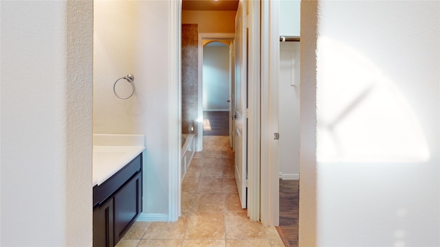 bathroom with tile patterned floors and vanity