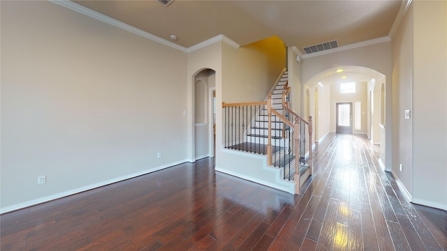 entryway with crown molding and dark hardwood / wood-style floors