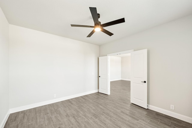 living room with light wood-type flooring and a towering ceiling