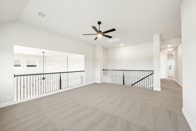 carpeted living room with lofted ceiling