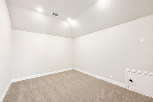 living room with lofted ceiling and light carpet