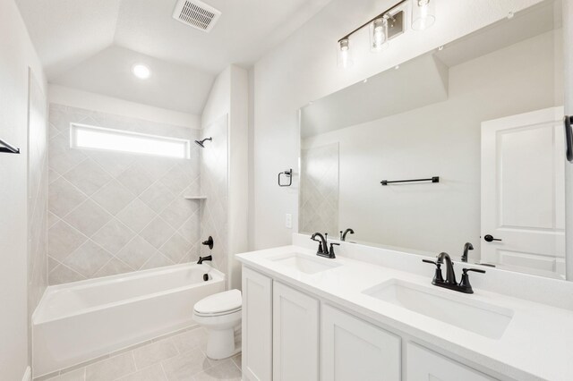 full bathroom with toilet, vaulted ceiling, a sink, and bathing tub / shower combination