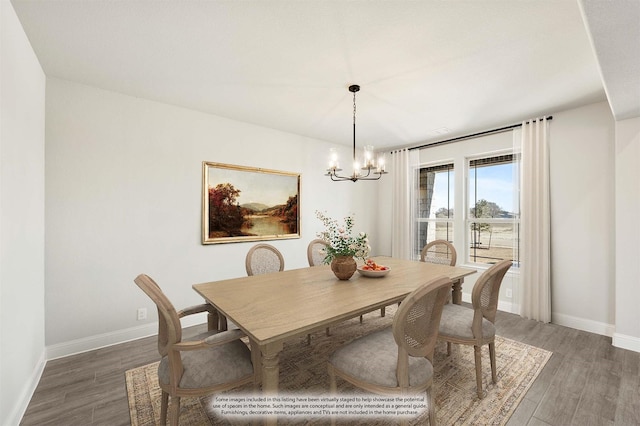 dining area featuring an inviting chandelier, baseboards, and dark wood finished floors