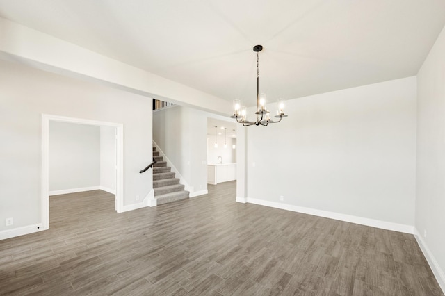 living room with a wealth of natural light, light hardwood / wood-style floors, and a towering ceiling