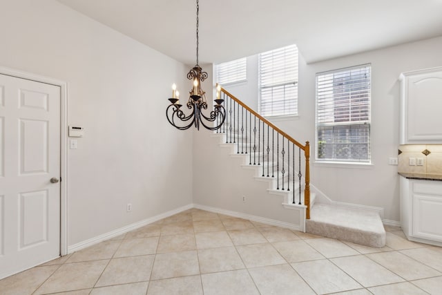 interior space featuring light tile patterned flooring and an inviting chandelier