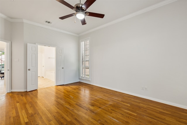 unfurnished bedroom with ceiling fan, crown molding, and light hardwood / wood-style flooring