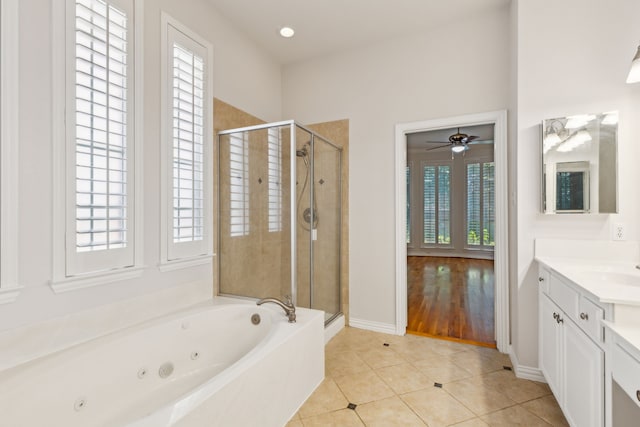 bathroom featuring vanity, hardwood / wood-style floors, ceiling fan, and independent shower and bath