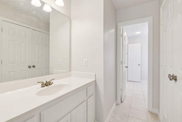 bathroom with tile patterned floors and vanity