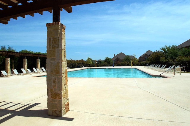 view of swimming pool with a patio area