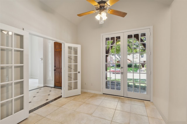 doorway to outside with lofted ceiling, french doors, light tile patterned floors, and ceiling fan