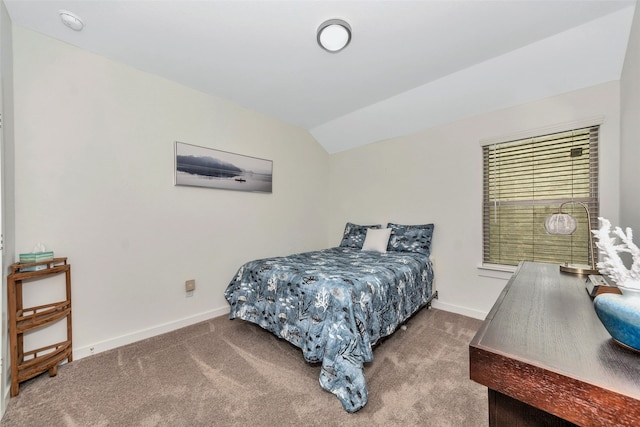 bedroom with vaulted ceiling and carpet