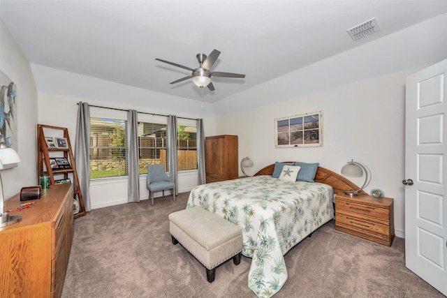 bedroom featuring ceiling fan and carpet