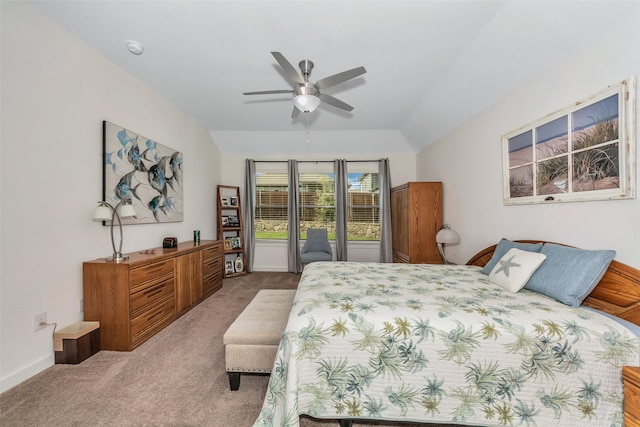 bedroom featuring carpet floors, vaulted ceiling, baseboards, and a ceiling fan