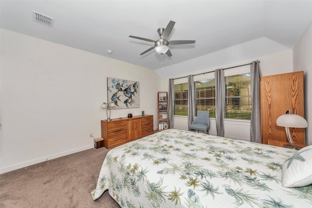 bedroom featuring lofted ceiling, a ceiling fan, visible vents, baseboards, and carpet