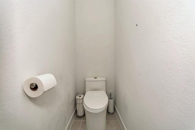 bathroom featuring toilet and tile patterned floors