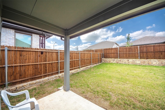 view of yard with a fenced backyard