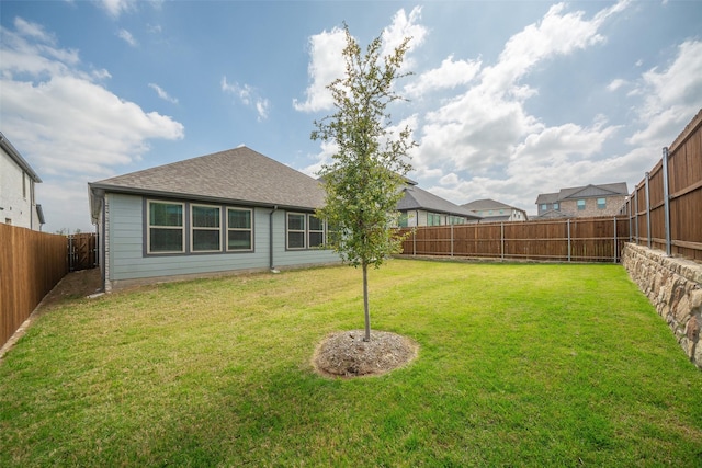 view of yard featuring a fenced backyard