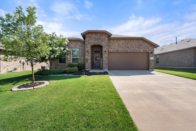 view of front of property with a garage and a front lawn