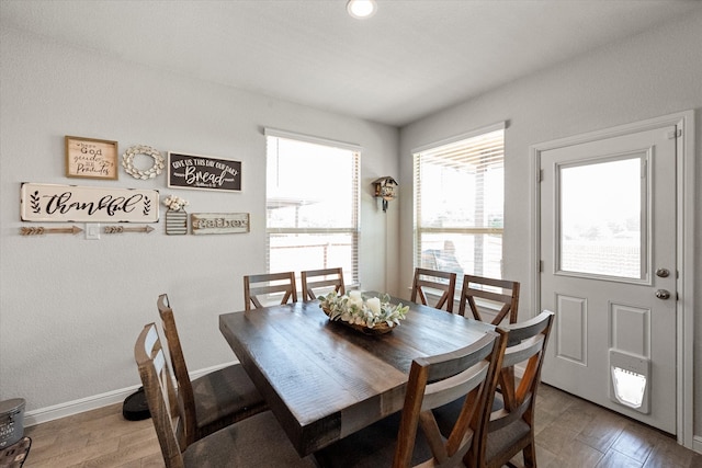 dining area with wood-type flooring