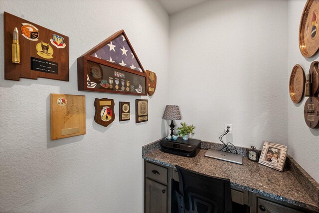 bar featuring dark stone counters