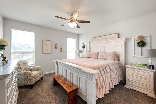 bedroom with ceiling fan and dark carpet