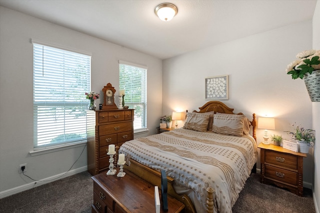 bedroom featuring dark carpet