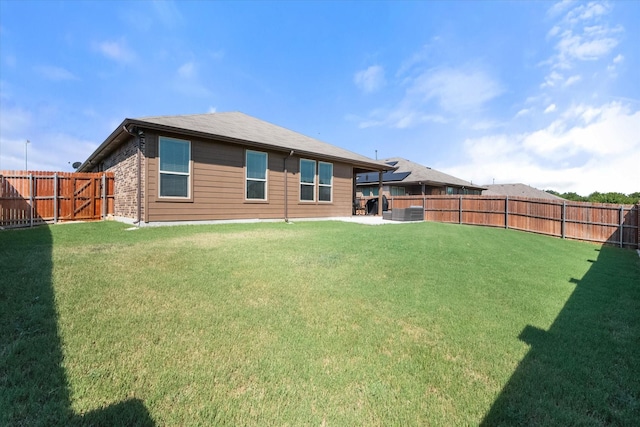 rear view of house with a lawn