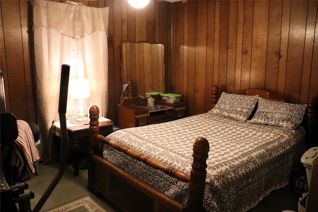 bedroom with wood walls