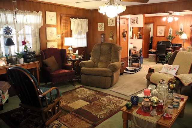 living room featuring ceiling fan, wood walls, and carpet floors