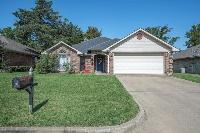 ranch-style home featuring a front lawn and a garage