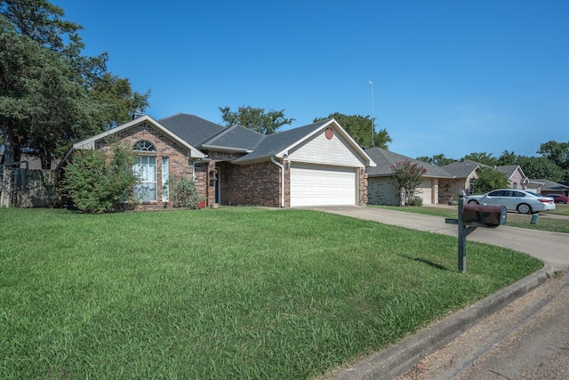 ranch-style house featuring a front yard and a garage