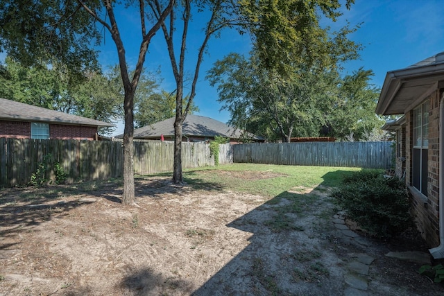 view of yard featuring a fenced backyard