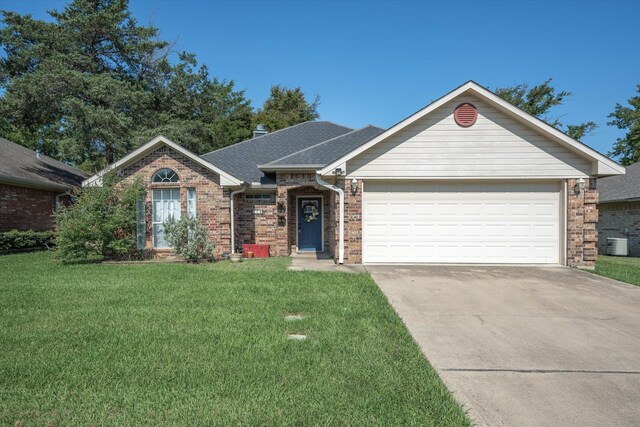 ranch-style house with a garage, driveway, brick siding, and a front lawn