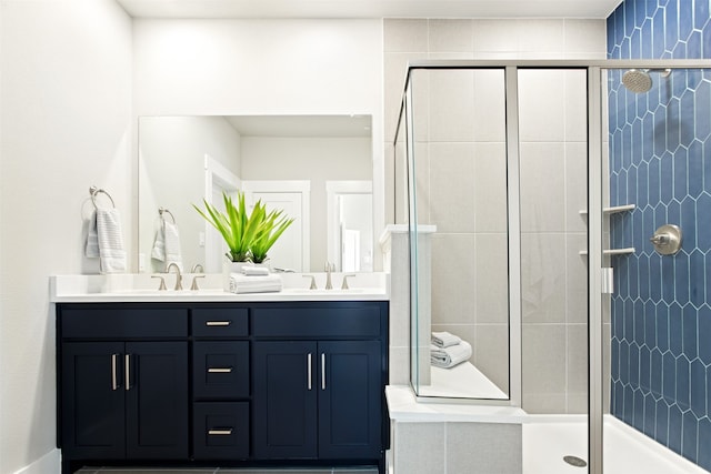 bathroom with vanity and an enclosed shower