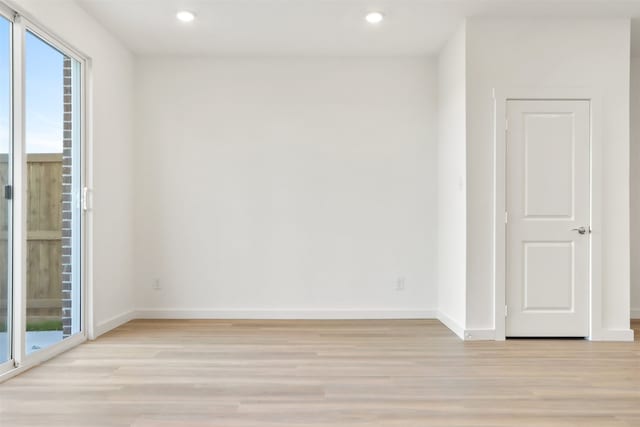 empty room with light wood-type flooring