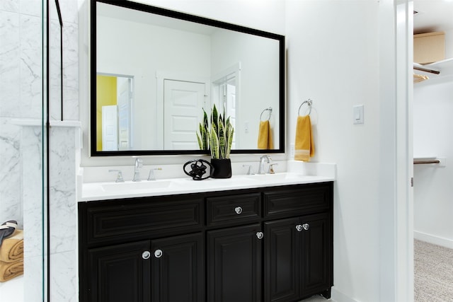 730 Tower Rd, Wylie, TX 75098 - full bathroom featuring double vanity, a spacious closet, baseboards, and a marble finish shower
