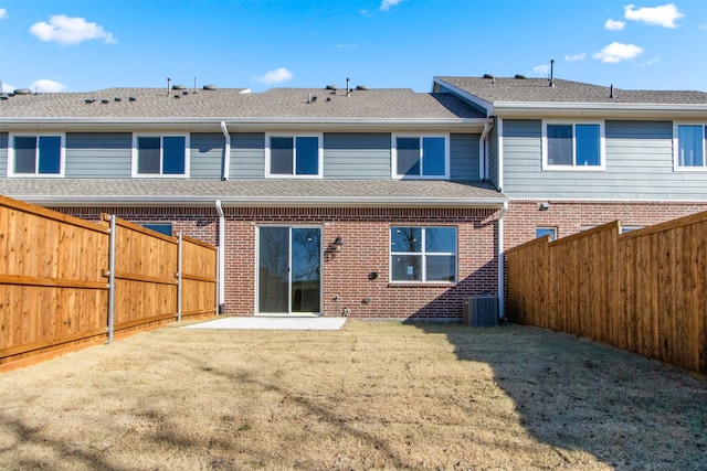 back of house with a yard and a patio area