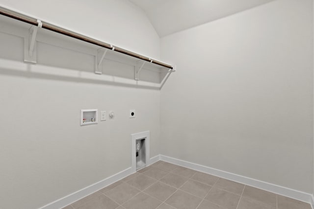 washroom featuring hookup for a washing machine, gas dryer hookup, electric dryer hookup, and light tile patterned floors