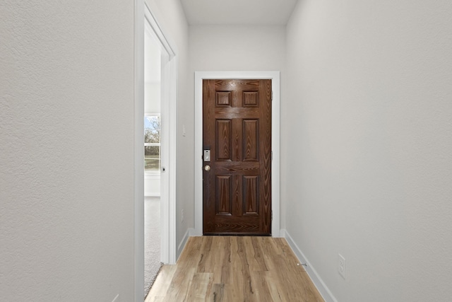 doorway to outside with light hardwood / wood-style floors