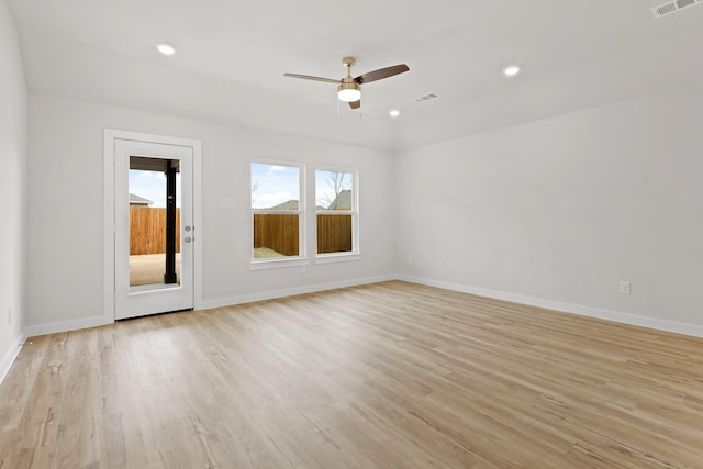 empty room featuring ceiling fan and light wood-type flooring