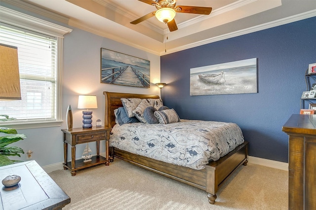 bedroom featuring multiple windows, a raised ceiling, and crown molding