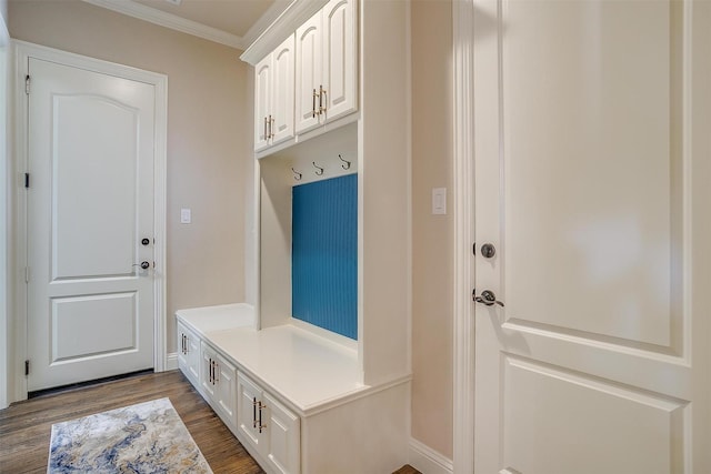 mudroom with crown molding, dark wood finished floors, and baseboards